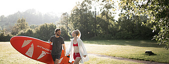 Alpsee Camping Immenstadt | Paar mit Stand-Up Paddle Board